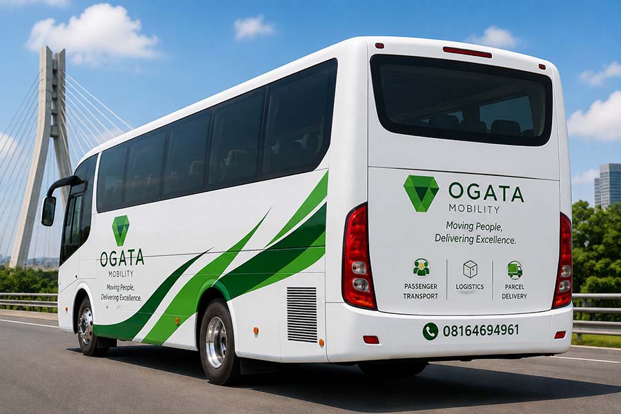 An Ogata Mobility coach on the highway in the company's green and white livery.